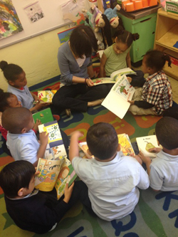 Student teacher and children reading stories