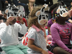 Children wearing cartoon masks
