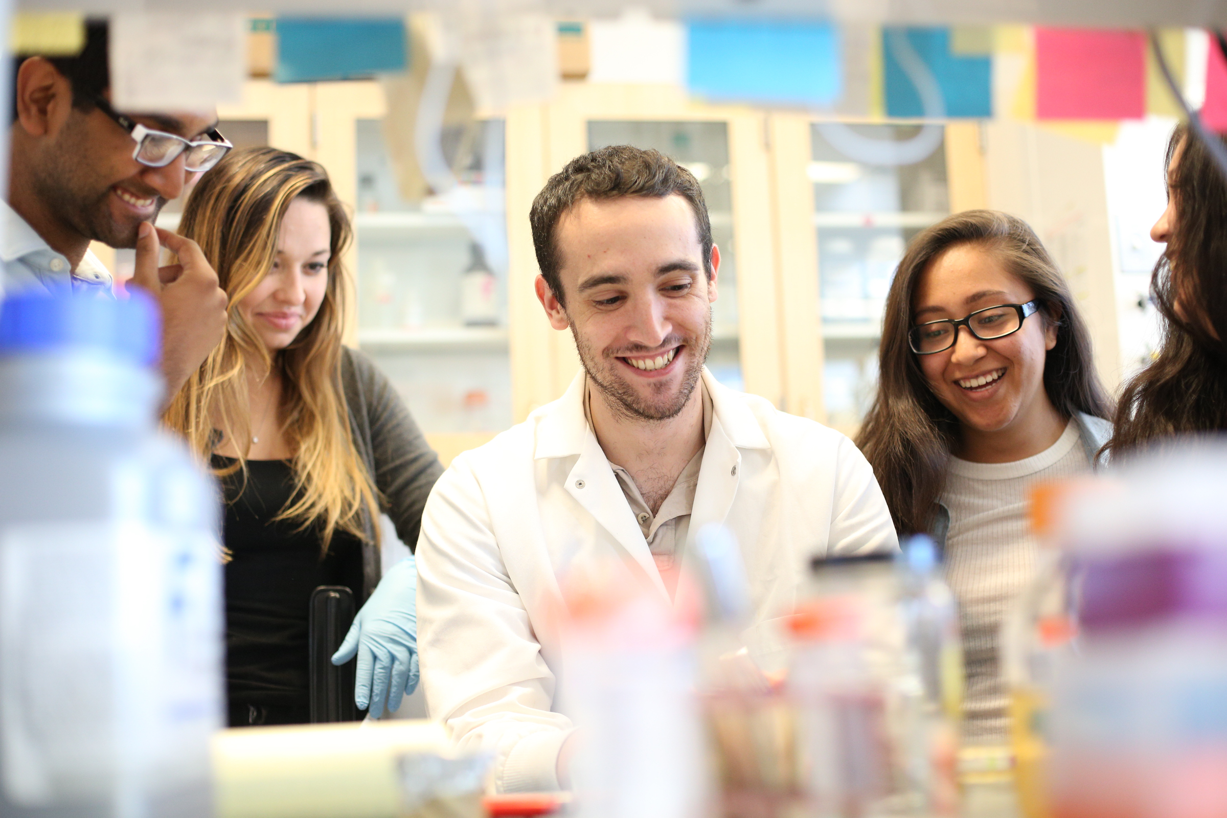 science students at a lab smiling