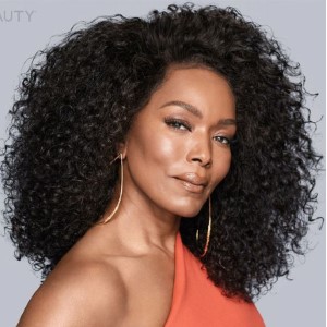 Angela Basset is looking into the camera from the side