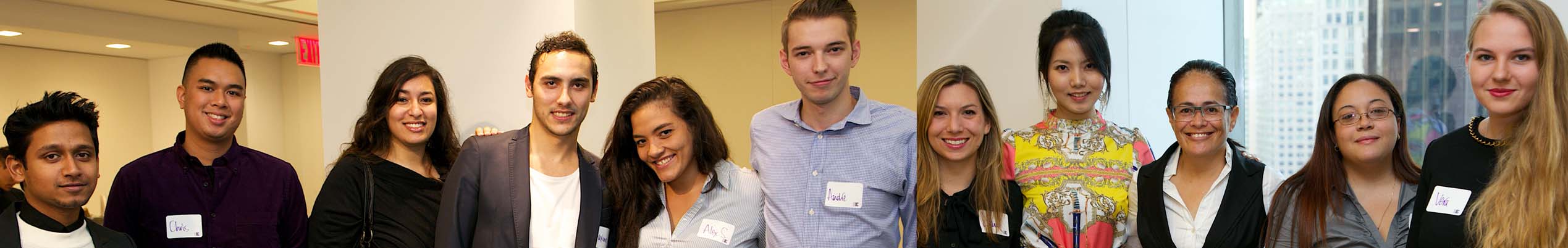 Group photo of BIC Master's students standing side by side at mixer event
