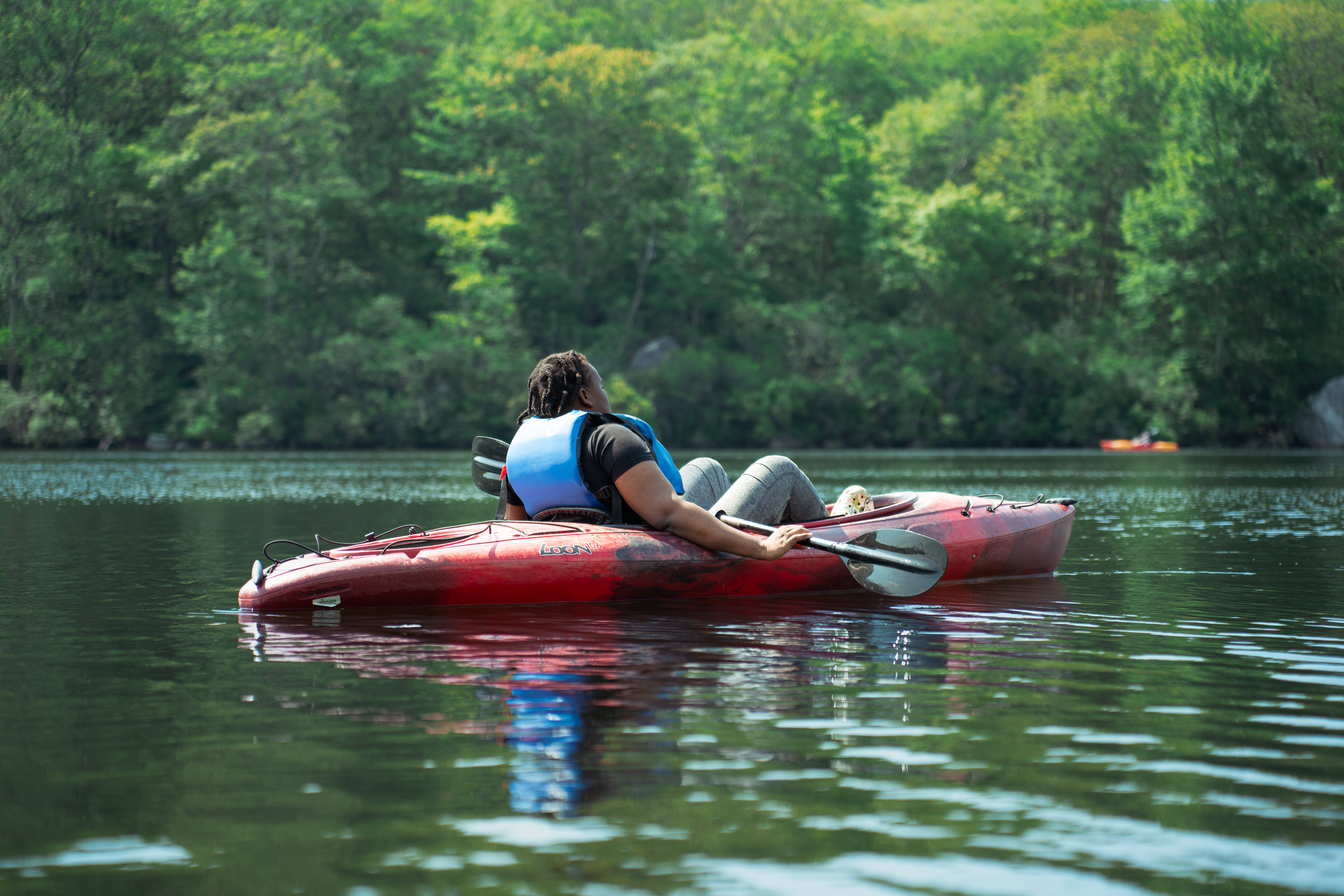 CCNY student in kayak on the Bear Mountain Lake.