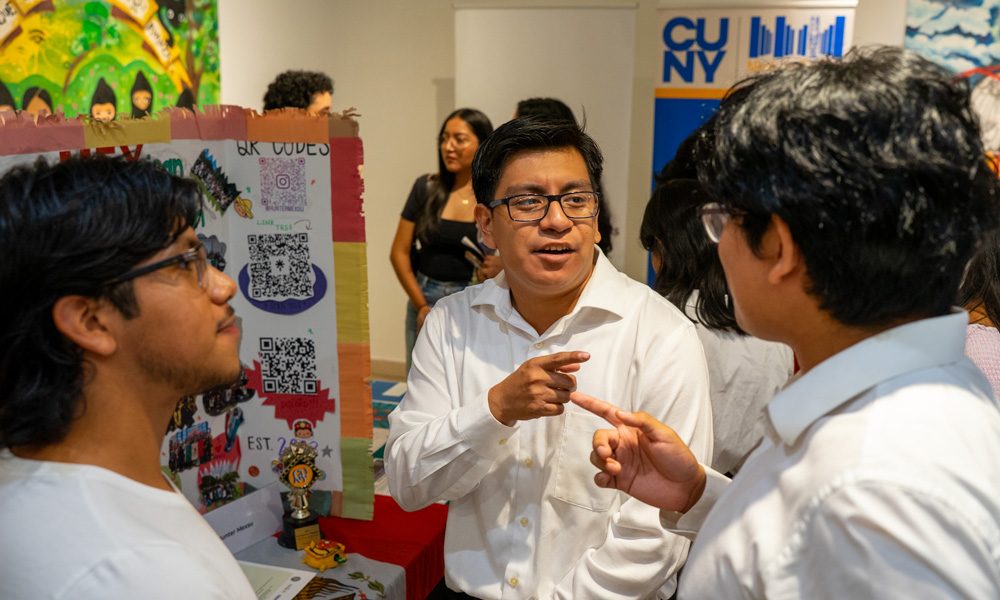  Immigrant Student Center for Resources and Research students looking at each other