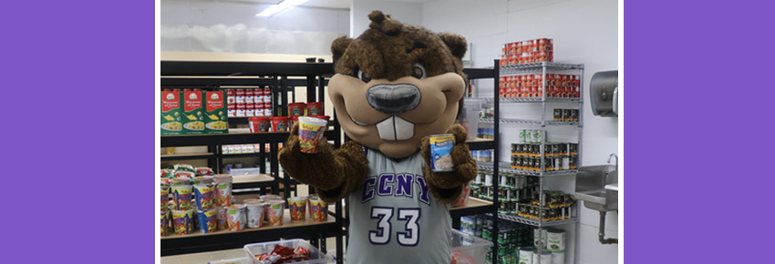 Giving Tuesday Benny holding can food