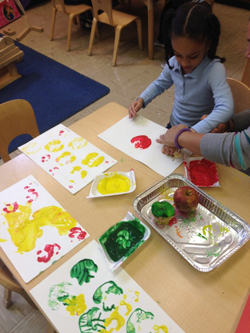 Children making handprints