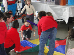 Students interacting with teacher in an art activity