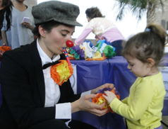 Teacher dressed up with a child at Family Arts Day 2013