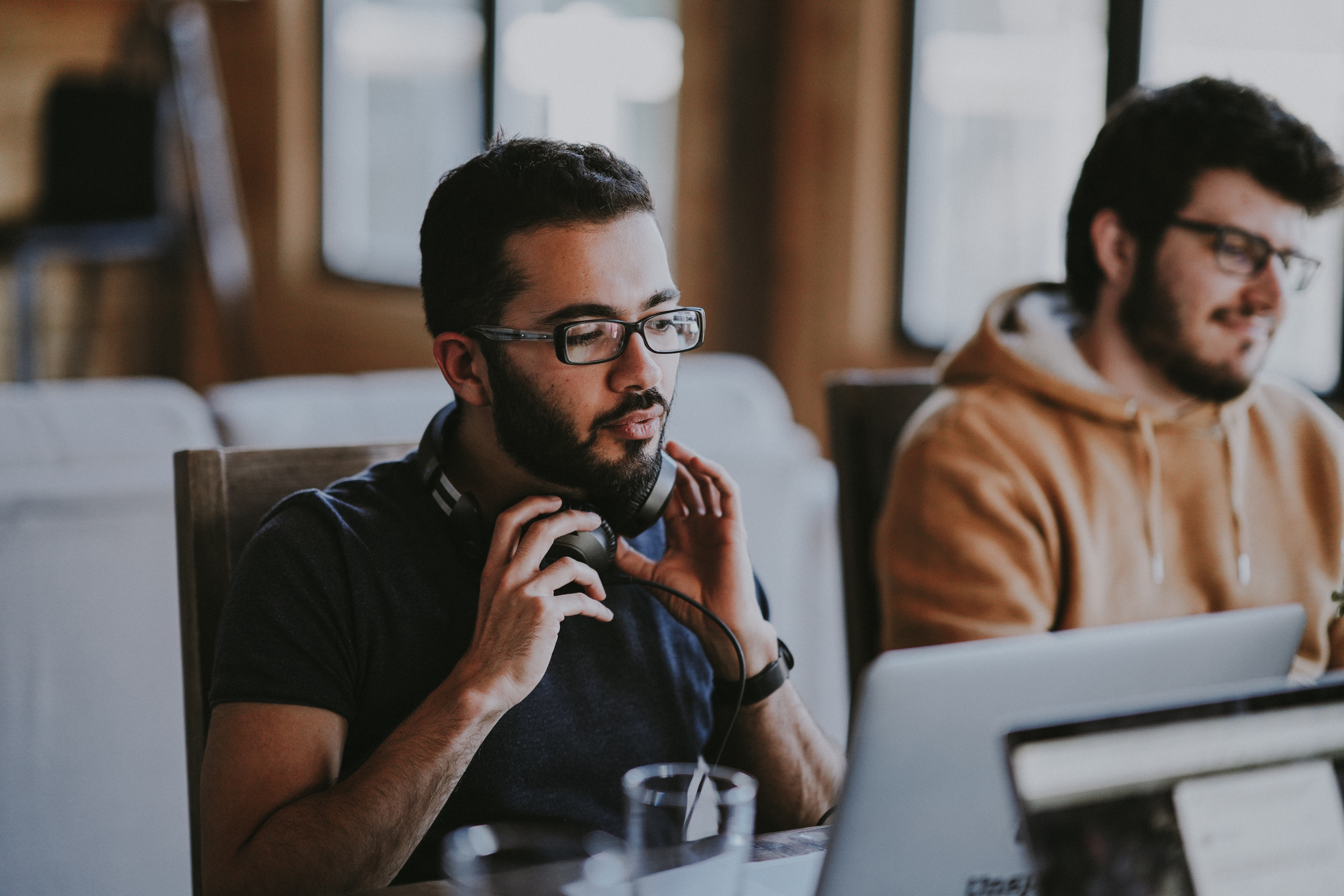 two guys in front of computers
