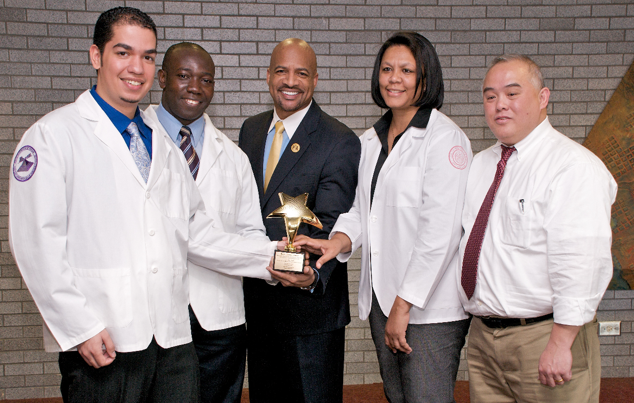 The 2009 New York State Physician Assistants Association (NYSPAA)  Medical Jeopardy challenge was won by a team from The Sophie Davis School of Biomedical Education.  At the trophy presentation were (left to right): senior Miguel Santiago; senior Ifeanyi Nwobi; Adrian Llewellyn, president-elect of NYSPAA; junior Patricia Nelson, and team Coach David Lau.