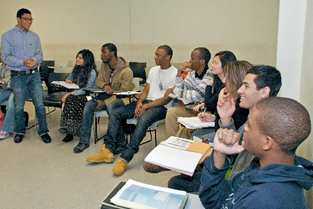 Jeremy Wilson [standing] making a presentation to fellow Scholars in the Skadden, Arps, Slate, Meagher & Flom Honors Program at CCNY. 