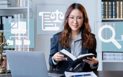 Woman in office holding papers.