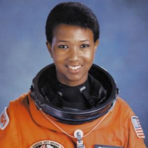 Mae Jemison M.D. looking into the camera in a space suit