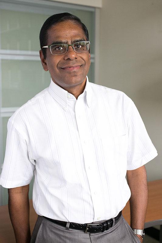 Dr. George John