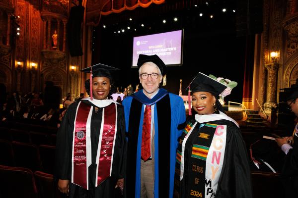 Two Colin Powell School MPA Graduates and Associate Dean Kevin Foster smile for the camera
