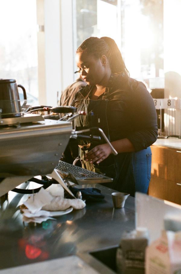 Barista serving coffee