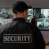 Security guard monitoring cameras
