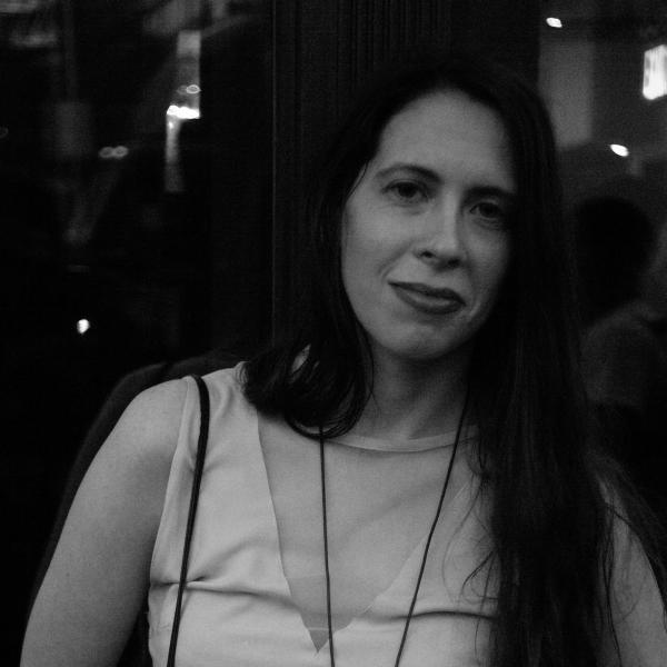 A black and white photo of Rosenblatt in front of the Bowery Poetry Club. Photo by Thomas Sayers Ellis