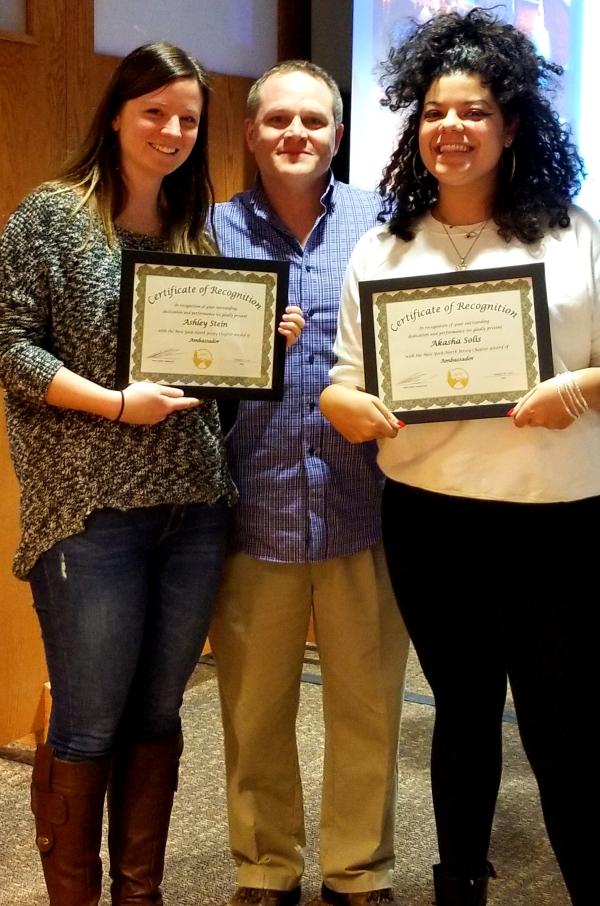 CCNY alumni Ashley Stein (left) and Akasha Solis (right) celebrate their recognition with Nathan Baker, AMC NY/No-J Chapter Chair