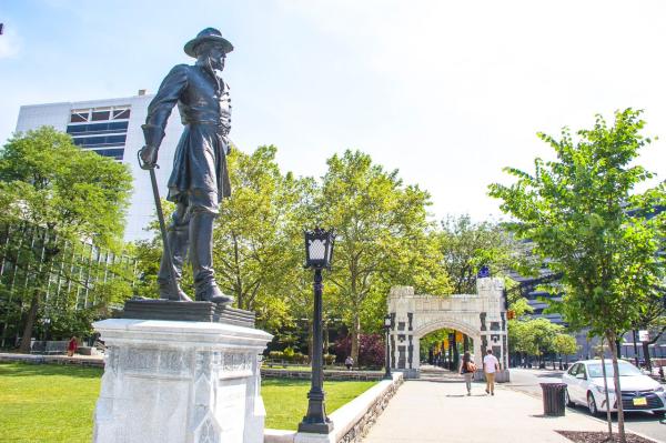 Photo of campus with statue of General Webb
