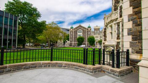 grassy lawn and neo gothic buildiings on CCNY campus