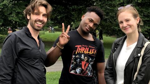 Doctoral students hanging out in a park