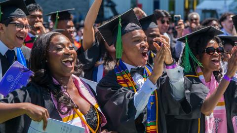 Students smiling at commencment 