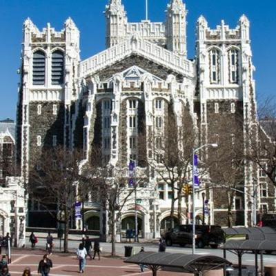 Photo of the CCNY Shepard Hall Building with clear blue skies