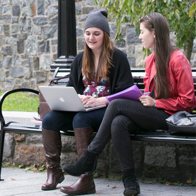 Two students looking at computer screen