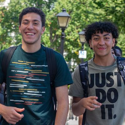 Two students smiling
