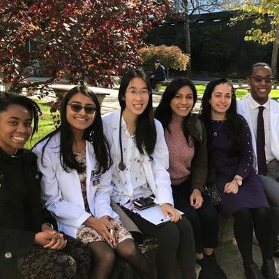 A group of students sitting on campus