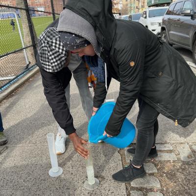 Testing water runoff along different surfaces outdoors