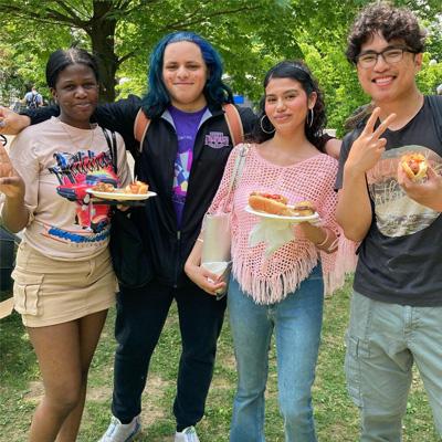 4 students eating at CCNY BBQ