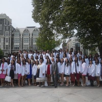 CUNY Med Dean Carmen Renée Green and Chancellor Félix V. Matos Rodríguez with graduating class.