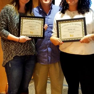 CCNY alumni Ashley Stein (left) and Akasha Solis (right) celebrate their recognition with Nathan Baker, AMC NY/No-J Chapter Chair