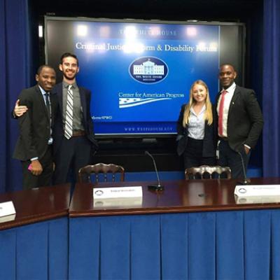 Abubakar Usman (far left) and Asshur Cunningham (far right) helped coordinate a White House briefing on criminal justice and disability reform.