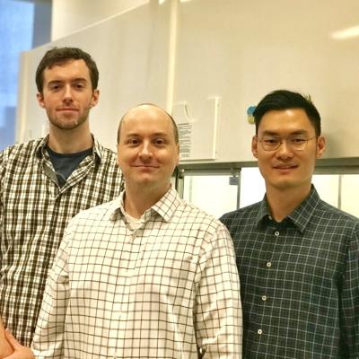 Ph.D. candidates Benjamin Murray, left, and Shibin Zhao, right, flank CCNY chemistry professor Mark Biscoe.