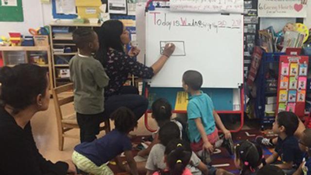 Teacher with students