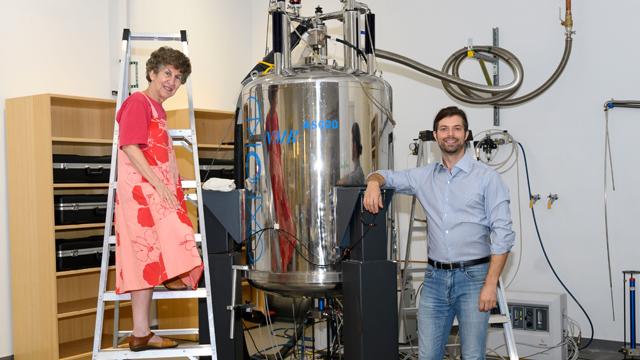 Ruth Stark, a CUNY Distinguished Professor, and Robert Messinger, a CUNY Assistant Professor, in front of a large NMR magnet at CCNY. It’s one of the research instruments to be upgraded with the NSF grant.