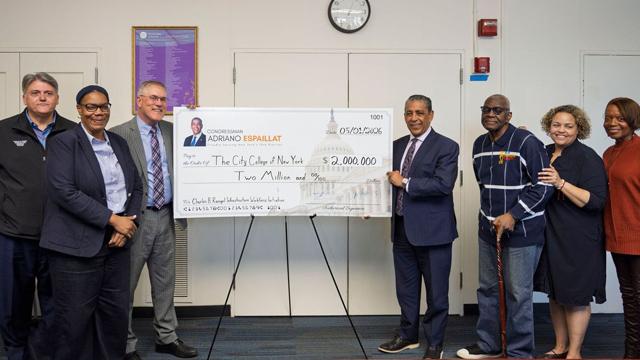 Rep. Adriano Espaillat [4th from right] at CCNY, whose Rangel Initiative is the beneficiary of $2M in federal funding sourced by the Congressman. Third from left is CCNY Pres. Vincent Boudreau, and other senior officials.