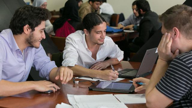 Three students studying 